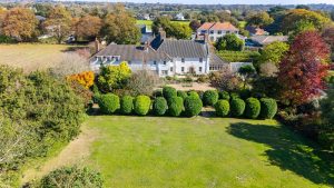 AN IMPRESSIVE FAMILY HOME WITH EXTENSIVE GROUNDS, POOL, AND TENNIS COURT