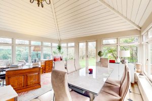 AN IMPRESSIVE FAMILY HOME WITH EXTENSIVE GROUNDS, POOL, AND TENNIS COURT