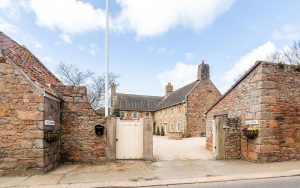 AN IMPRESSIVE FAMILY HOME WITH EXTENSIVE GROUNDS, POOL, AND TENNIS COURT