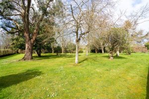 AN IMPRESSIVE FAMILY HOME WITH EXTENSIVE GROUNDS, POOL, AND TENNIS COURT