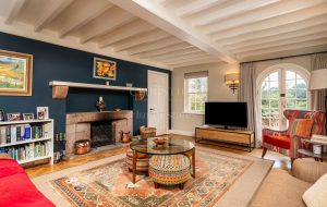 AN IMPRESSIVE FAMILY HOME WITH EXTENSIVE GROUNDS, POOL, AND TENNIS COURT