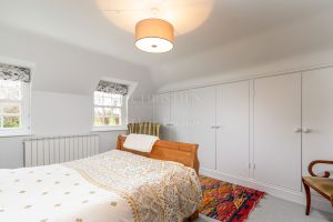 AN IMPRESSIVE FAMILY HOME WITH EXTENSIVE GROUNDS, POOL, AND TENNIS COURT