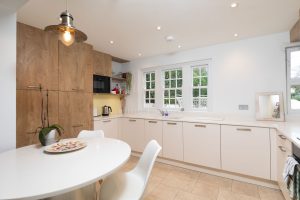 AN IMPRESSIVE FAMILY HOME WITH EXTENSIVE GROUNDS, POOL, AND TENNIS COURT