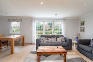 AN IMPRESSIVE FAMILY HOME WITH EXTENSIVE GROUNDS, POOL, AND TENNIS COURT