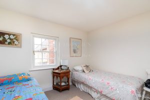 AN IMPRESSIVE FAMILY HOME WITH EXTENSIVE GROUNDS, POOL, AND TENNIS COURT