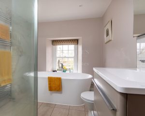 AN IMPRESSIVE FAMILY HOME WITH EXTENSIVE GROUNDS, POOL, AND TENNIS COURT