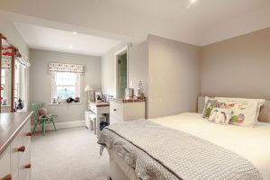 AN IMPRESSIVE FAMILY HOME WITH EXTENSIVE GROUNDS, POOL, AND TENNIS COURT