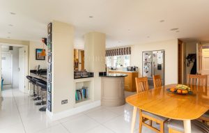 AN IMPRESSIVE FAMILY HOME WITH EXTENSIVE GROUNDS, POOL, AND TENNIS COURT