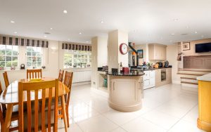 AN IMPRESSIVE FAMILY HOME WITH EXTENSIVE GROUNDS, POOL, AND TENNIS COURT