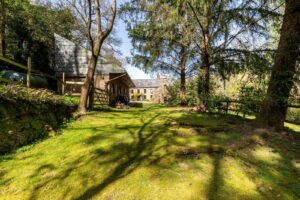 A Hidden Granite Farmhouse of Character, Privacy and Unexpected Space