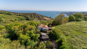 Elevated Coastal Living with Panoramic Valley and Sea Views