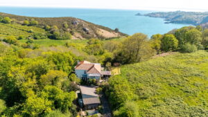 Elevated Coastal Living with Panoramic Valley and Sea Views