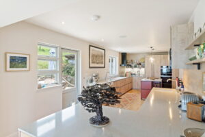 Elevated Coastal Living with Panoramic Valley and Sea Views