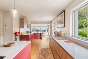 Elevated Coastal Living with Panoramic Valley and Sea Views