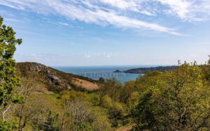 Elevated Coastal Living with Panoramic Valley and Sea Views