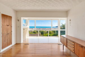 Elevated Coastal Residence with Panoramic Views and Exceptional Potential